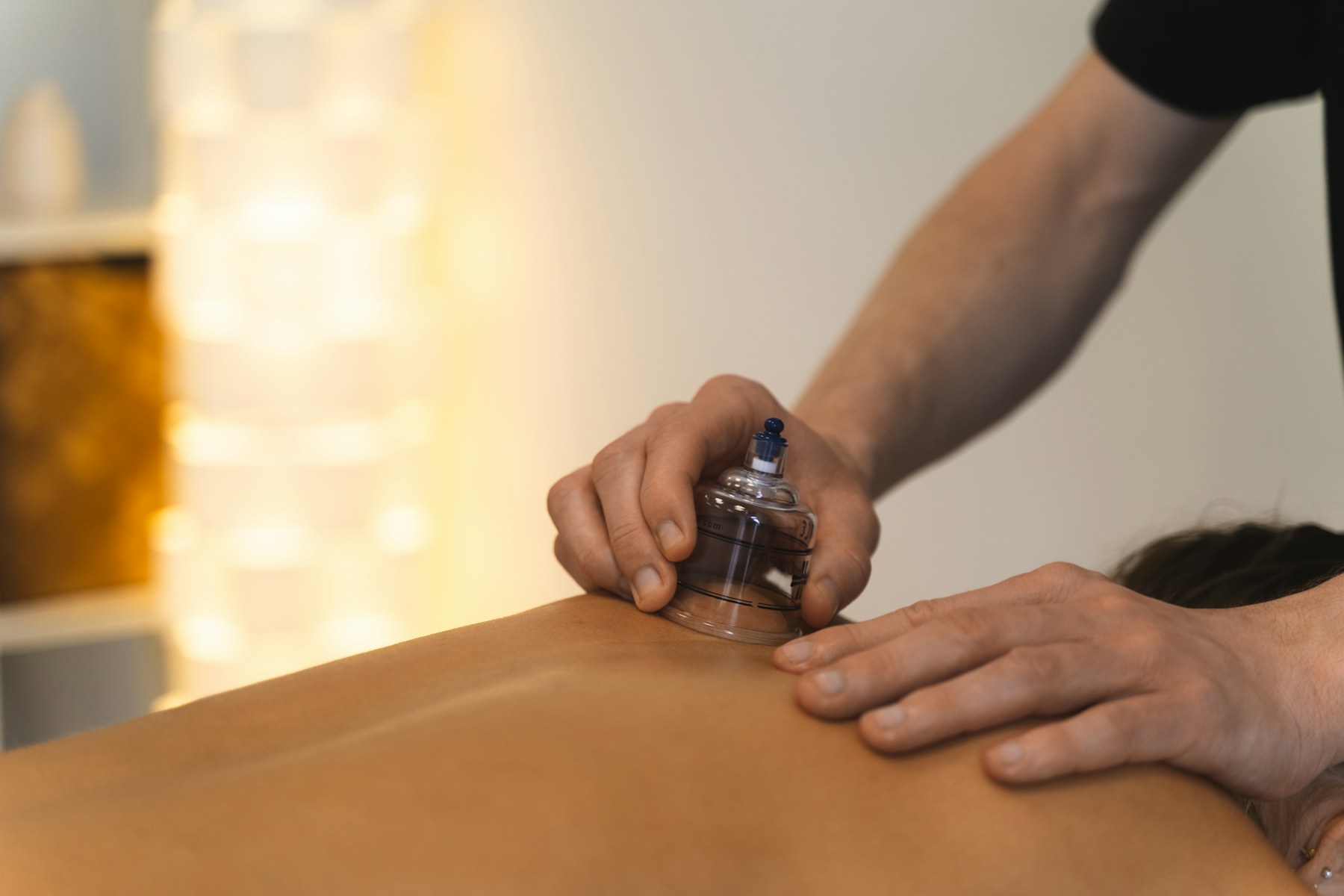 Cupping therapy applied during a recovery-focused body treatment.